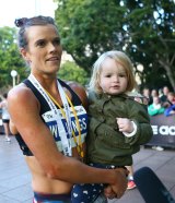 Eloise Wellings, with daughter India after winning the SMH Half Marathon on May 17, 2015, says the Zika virus outbreak the outbreak is disconcerting.