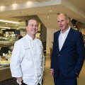 Celebrity chef Neil Perry (left) with David Jones CEO John Dixon: The department store's appetite for Australia's upmarket foodies could hurt Coles and Woolworths, credit agency Moody's warns.