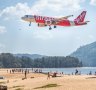 An AirAsia flight comes in for a landing at Phuket Airport.