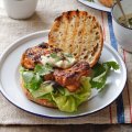 Bill Granger's grilled chicken thigh burgers with tahini and chilli relish.