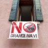 No big ships sign hangs in a Dorsoduro window.