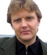 Alexander Litvinenko, former KGB spy and author of the book <i>Blowing Up Russia: Terror From Within</i>, at home in London in 2002. 
