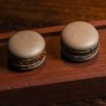 Signature black garlic macarons filled with salmon roe are available in the restaurant and its adjacent bar.