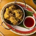 Crispy deep-fried chicken wings with chilli sauce.