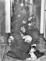 Firefighters, police and Salvation Army staff try to resuscitate victims on the night of the Salvos hostel fire.