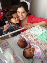 Amanda Robinson with her oldest son, Jasper, and twins Luca and Tristan.