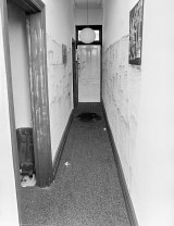 The hallway where the body of Susan Bartlett was found near the front door.