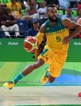 Top of their Games: Patty Mills drives forward for the Boomers. 