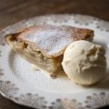 A wedge of Ben's apple pie with vanilla ice-cream.