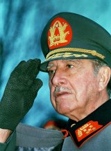 General Augusto Pinochet  salutes supporters on his 74th birthday, November  25, 1989.