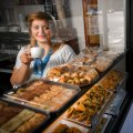 Sweet success: after three years in Australia, Joumana Charaf now runs the Trio Pasta, Sweets and Nuts in Lygon Street, Carlton, with her family. 