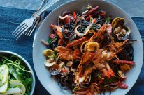 Squid ink pasta with vongole, chorizo and roasted prawn oil, and a pear, parmesan and rocket salad on the side.