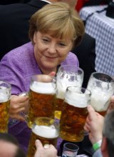 Handling it: Angela Merkel raises a glass at a traditional folk festival in southern Germany in 2012.