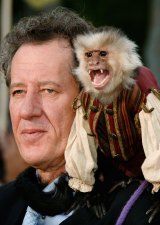 Geoffrey Rush poses with a trained monkey at the premiere of Pirates of the Caribbean film in 2007.