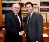 With his then employer, prime minister John Howard, in Canberra in 2004.