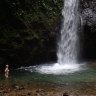 We walk to spectacular waterfalls and then dive in to cool off.