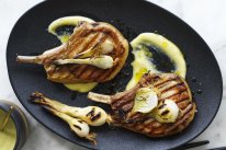 Barbecued pork chops with lemon garlic sauce and pickled spring onions.