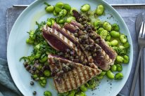 Barbecued tuna steaks with broad beans and roughly chopped  tapenade.