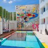 Makes you smile: The pool and graffiti wall at Luna2.