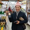 Chae buying olive oil at Mediterranean Wholesalers.