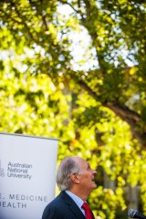 Professor Alan Alda, competes with a cockatoo during his speech at the official opening of the Alan Alda Centre at The Australian National Centre for the Public Awareness of Science (CPAS) at the ANU.