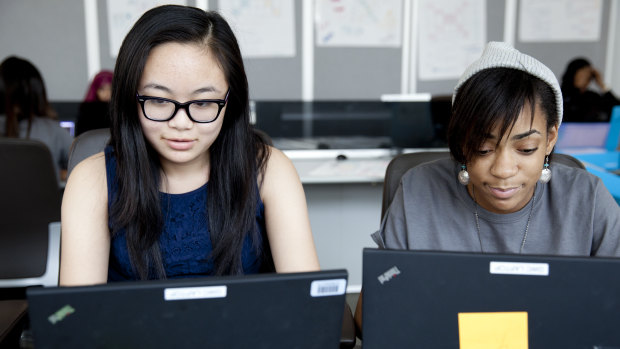Girls learn to code as part of Girls Who Code.