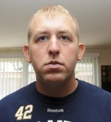 Officer Darren Wilson in an undated photo released by the St Louis County Prosecutor's Office.