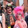 Fans display their costumes along Fifth Avenue in San Diego's Gaslamp Quarter during last year's Comic Con.