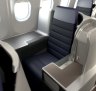 Malaysia Airlines A330-300 business class cabin features window seats alternating between singles and pairs.