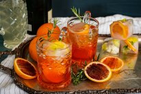 Aperol spritzes with optional fruit-filled ice cubes. 