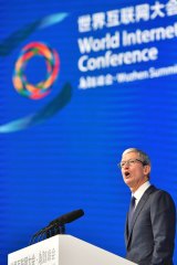 Apple's CEO Tim Cook delivers a speech at the opening ceremony of the Fourth World Internet Conference in Wuzhen town in Tongxiang.