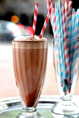 A double chocolate and peanut butter shake made from white milk
