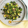 Kale, quinoa and blueberry salad with coconut dressing.