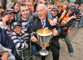 Sweetest win of all: Frank Costa holds the 2007 AFL premiership cup during a parade through Geelong.