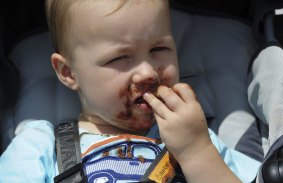 Blake Robinson, 2, of Watson, enjoys a chocolate icecream.