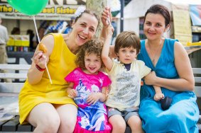 Carmen Jereb of Jerrabomberra with her daughter Maya, 2, and Oana Cozma of the Netherlands with her son Calin, 3, enjoying the festivities.