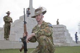 Australian Federation Guardsman, Trooper David Nicolson, with fellow guardsmen at Tyne Cot Cemetery in Belgium during a practice session in preparation for an official ceremony on Anzac Day.