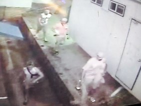 Police have released this image of four people seen near the Toowoomba Mosque around the time of the January arson attack. They believe the two fires could be linked and are appealing for information.
