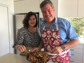 Opposition leader Tim Nicholls and his wife Mary making the Christmas supply of Nuts and Bolts.