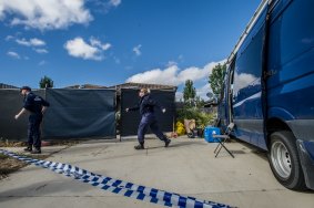 ACT Policing, AFP and forensic officers at the scene of the house fire and triple death in Peter Coppin street, Bonner.