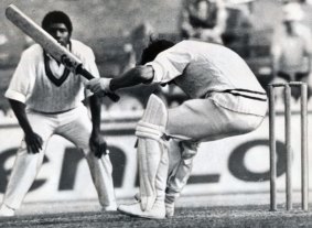 Peter Toohey almost falls backwards as he ducks under a rising ball from West Indian / West Indies Andy Roberts at the SCG.