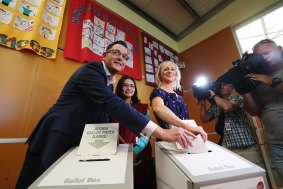 Labor leader Daniel Andrews votes at Albany Rise Primary School, Mulgrave, with his wife Cath.