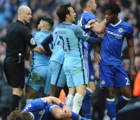 Tensions flared: Manchester City's Sergio Aguero, 2nd left, is sent off for a tackle on David Luiz.