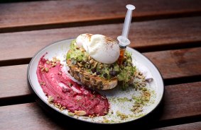 Squeeze to please: Avocado with poached eggs served at Dosage cafe in Burwood.