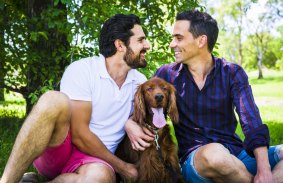 Paul Eldon, left, and his fiance Dan Sanderson with their dog Max. The couple plan to marry at the British High Commission in March.