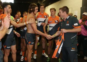 Welcome aboard: Luke Power presents Jack Steele with his Giants jumper before his debut.