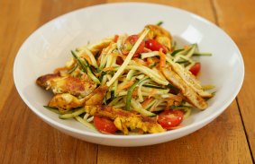 Zucchini noodles with cherry tomatoes and spicy chicken.