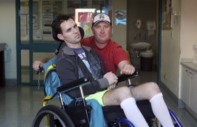 Matt Pridham with his father David in the Brains Injury Unit at Liverpool Hospital in Sydney in 2013.
