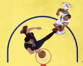 Bird's eye view of a Pelican: New Orleans star Anthony Davis dunks past Golden State Warriors forward Andre Iguodala.