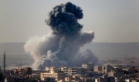 Desperate fight: A large explosion during a battle between Kurdish fighters and Islamic State in Kobane.
